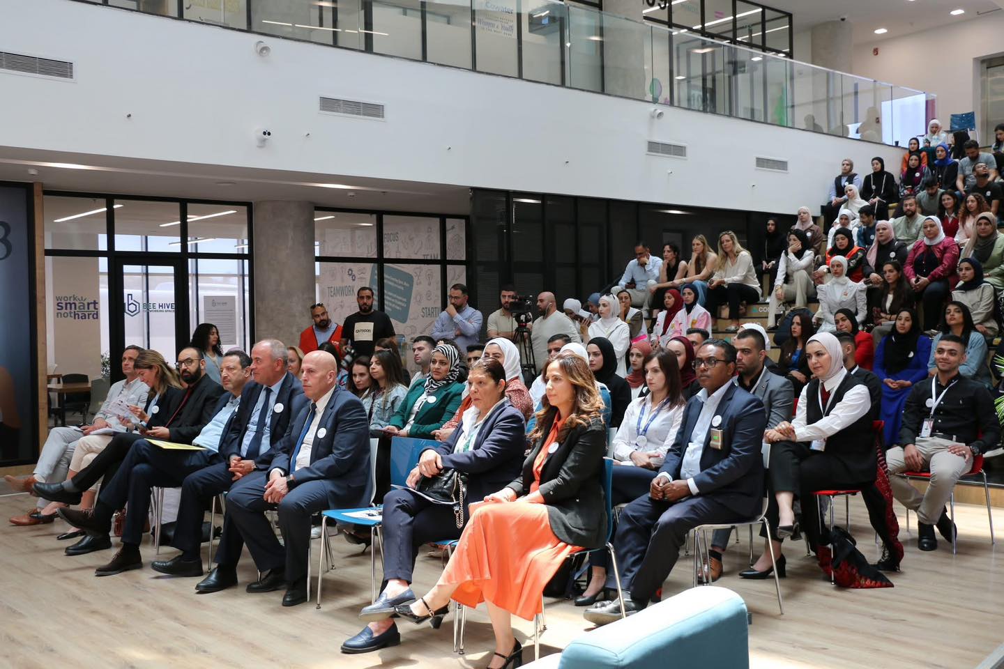 A full auditorium on the ground floor during a session