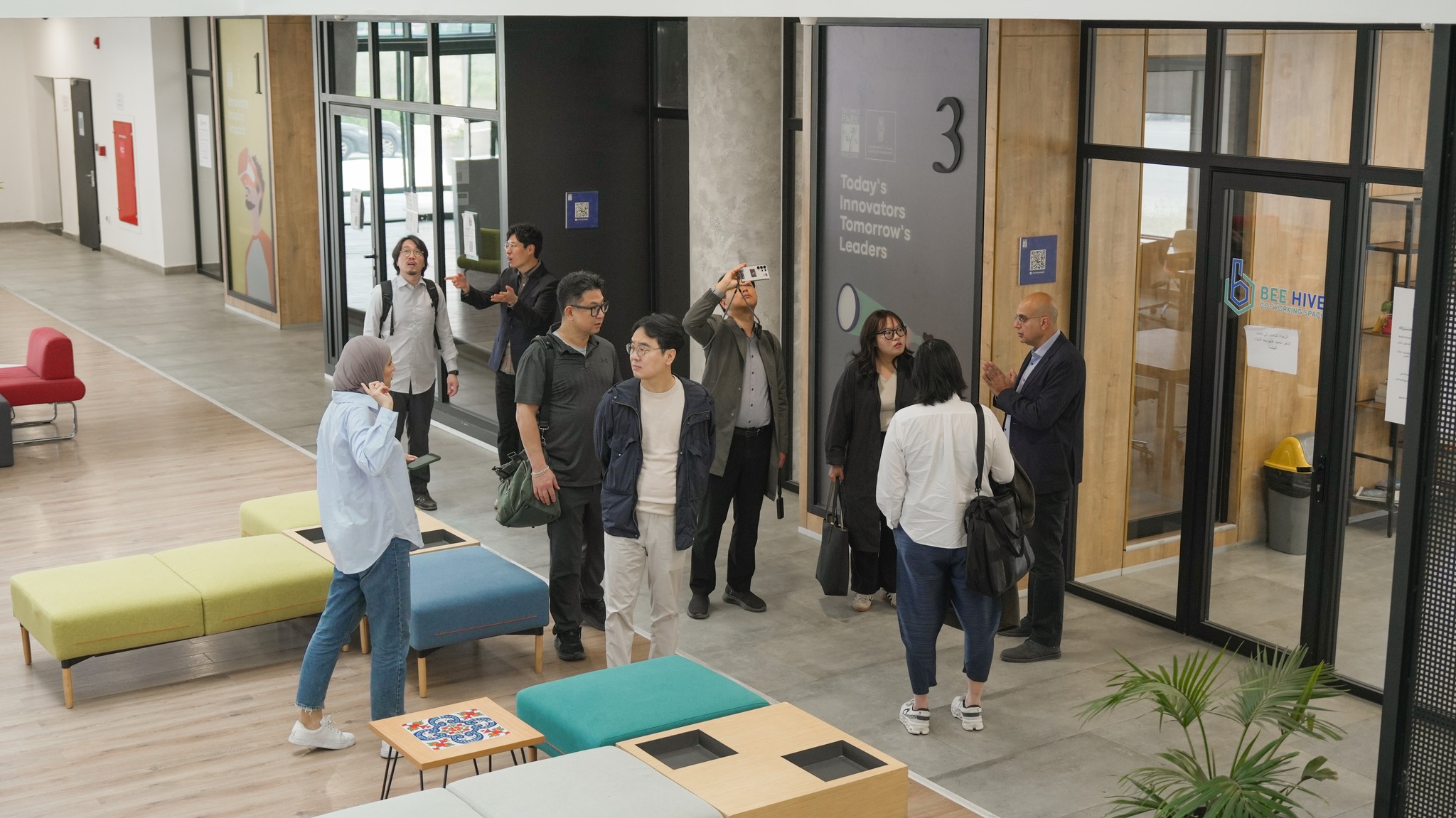 A visiting delegation touring the co-working floor
