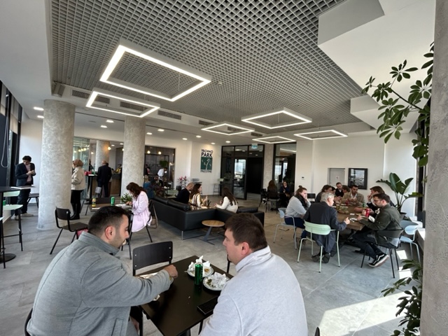 The cafe busy, with every table taken